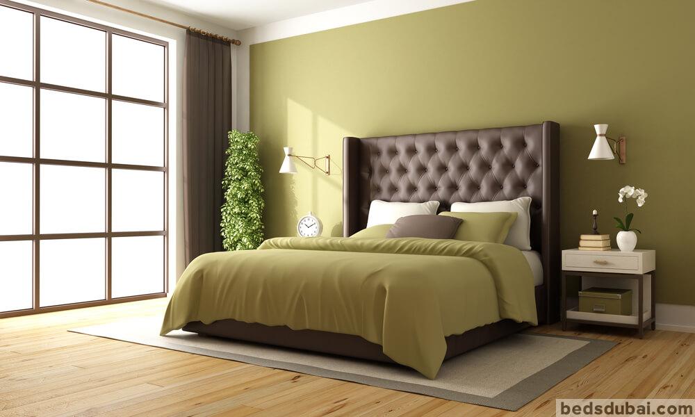 Classic brown and green master bedroom with leather double bed and nightstand - 3d rendering